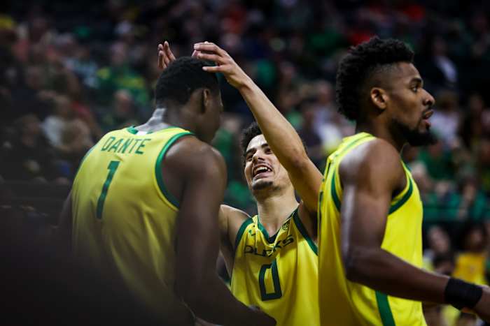 Oregon Ducks guard Will Richardson celebrates with center N'Faly Dante.